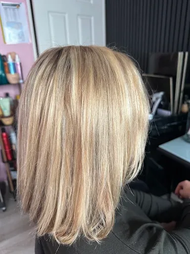 Long bob with fine blonde highlights blended through a golden base