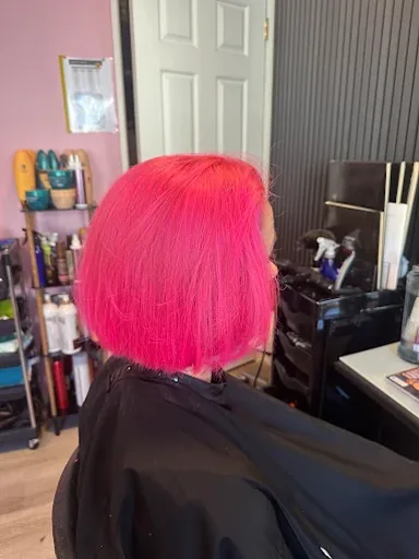 Blunt chin-length bob coloured bright hot pink