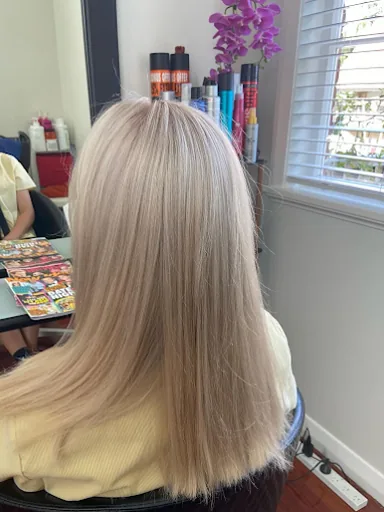 Long champagne blonde hair with a smooth, straight finish