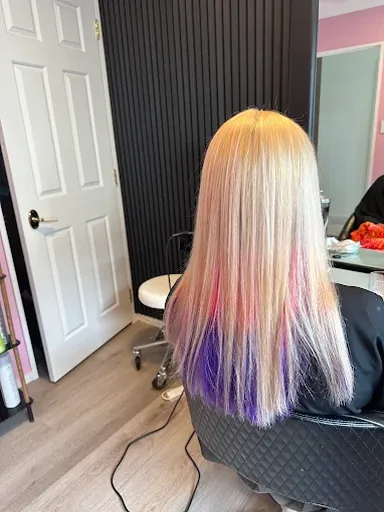 Long blonde hair with hidden pink and purple colour underneath